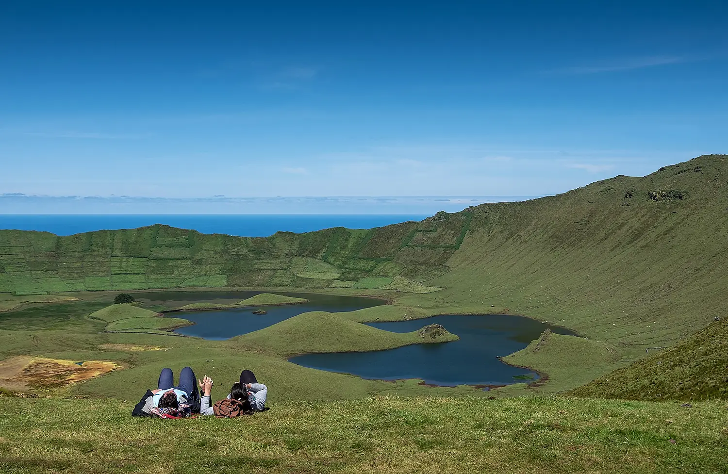 A couple enjoys the views of Caldeirão, Corvo Island, Azores, Portugal (PPL3-Altered) julesvernex2