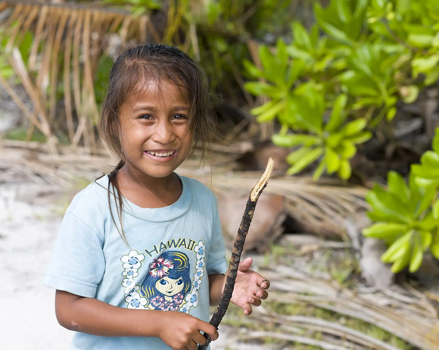Chistmas Island girl with stick - Kiritimati (14173486718)