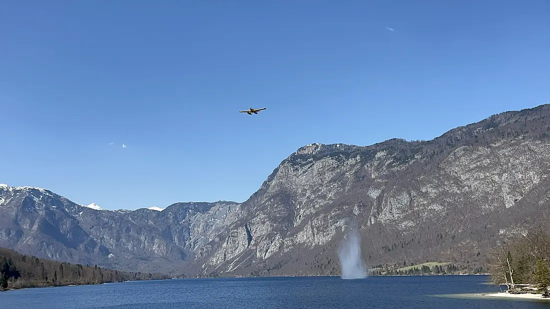 An amphibious plane taking off from Lake Bohinj, Slovenia