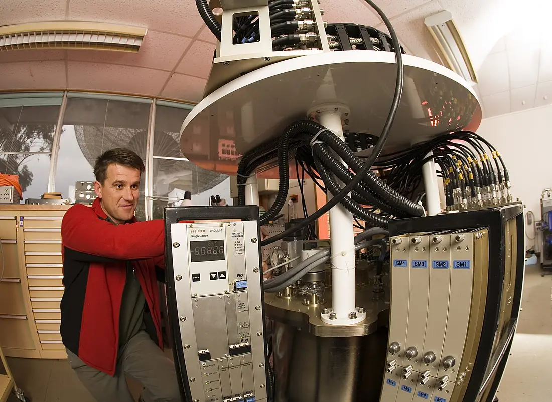 CSIRO ScienceImage 3682 A receiver technician works on the methanol multibeam receiver package at the CSIRO Parkes radio telescope